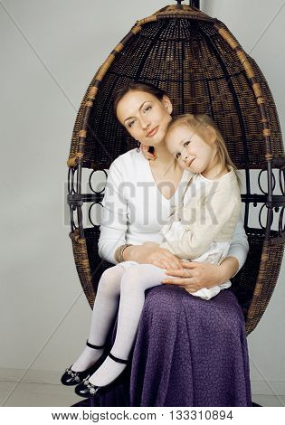 young mother with daughter at luxury home interior vintage, old fashion relashionship family
