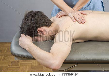 Physiotherapist Doing A Back Massage To Man Patient. Osteopathy.