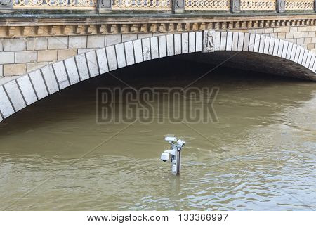  Surveillance cameras on the top of a pole are almost covered by water on the River Seine embankment after the massive flooding in Paris during the first days of June 2016.