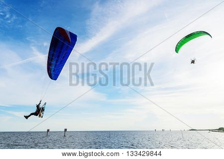 Man Ride Paramotor Flying In The Sky