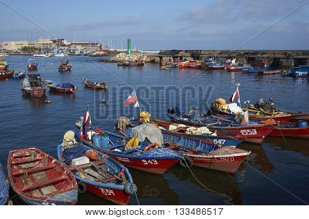 ANTOFAGASTA, CHILE - MAY 16, 2016: Colourful fishing boats in the harbour of Antofagasta on the Pacific coast of Chile.