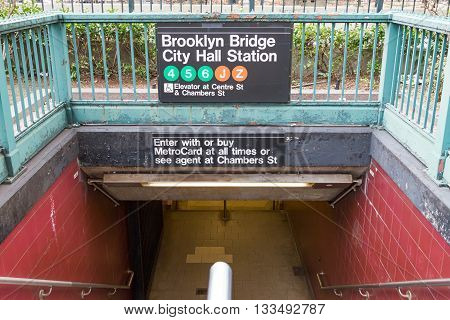 NEW YORK CITY - CIRCA 2016: The entrance to the Brooklyn Bridge City Hall subway station looks empty in the lower Manhattan area of New York City in 2016. The NYC subway system provides access to Manhattan Queens Brooklyn the Bronx and Staten Island.