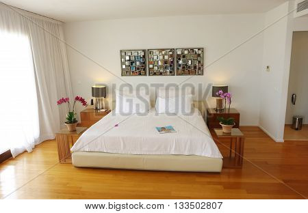 HERAKLION CRETE GREECE - MAY 13 2014: The Interior room with big bed in modern building of luxury class hotel on the Mediterranean coast of Crete May 13 2014 Greece.