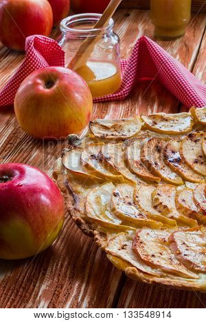 Pie: apple pie and apples on the wooden background