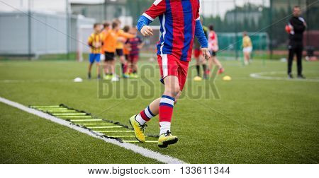Ladder Drills Exercises for Football Soccer team. Young player exercises on ladder drills