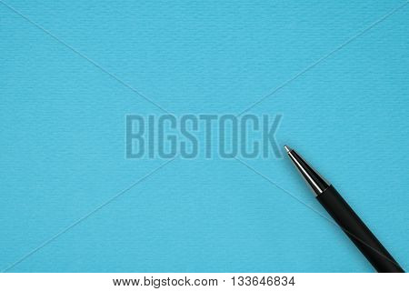 Blue papper background with black ball pen and text space