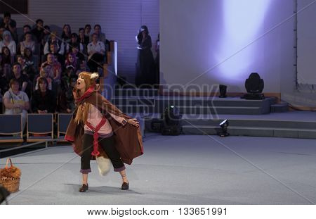 BRNO CZECH REPUBLIC - APRIL 30 2016: Cosplayer dressed as character Holo from Anime Spice and Wolf during cosplay contest at Animefest anime convention on April 30 2016 Brno Czech Republic