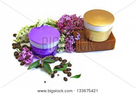 jar natural cream sprig bloom purple white lilac roasted coffee beans tar soap cosmetic scrub set isolated on white background. Feminine beauty and cosmetics concept green branch of medical kolanhoe