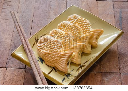 Taiyaki cakes on wood background Japanese confectionery