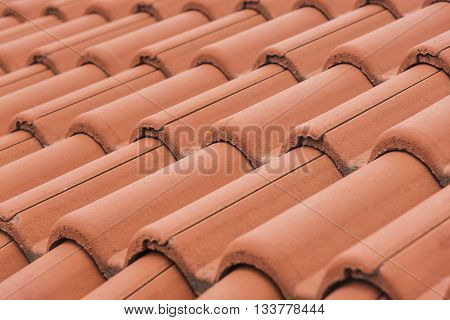 Close-up of roof tiles. Red roof texture.