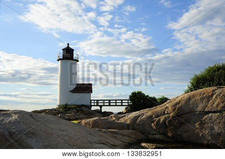 Sun sets behind Annisquam lighthouse in Massachusetts.