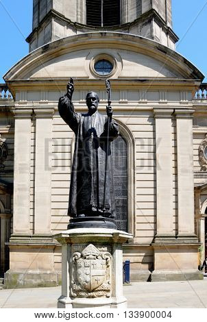 View of St Philips Cathedral and bell tower with a statue of Charles Gore the first bishop of Birmingham in the foreground Birmingham England UK Western Europe.