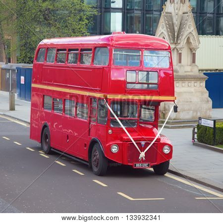 LONDON - APRIL 17: Red Double Decker Bus on the Canon street in London on April 17, 2016 in London, UK. These doubledecker bus is one of the most iconic symbols of London.