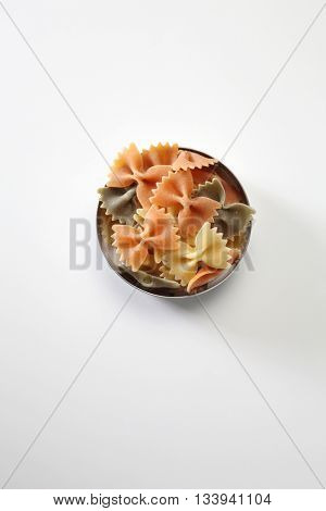 farfalle or farfalloni dry pasta on the white background