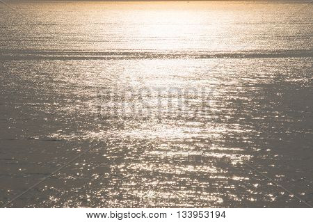 sunshine refrect on water surface in the morning in summer