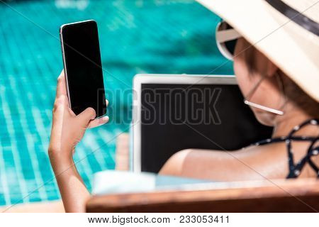 Beautiful Woman Working On Laptop And Mobile Smart Phone Near Swimming Pool Blue Water