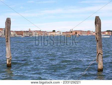 Two Poles Called Bricole In Italian Language To Moor The Gondolas In Venice And The Ancient Palaces 