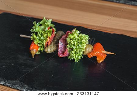 Spanish Snack, Banderillas On Skewers With Salami, Pickling Olives, Pickles, Green And Red Pepper.