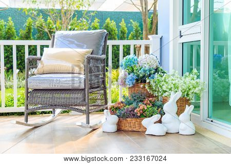 A Brown Pillow On Wooden Rocking Chair And Beautiful Bouquet Flower In The Basket And White Rabbit D