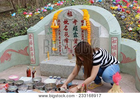 Ratchaburi, Thailand - April 4, 2017 : Thai People Praying Ancestor 
Worshipping With Sacrificial Of