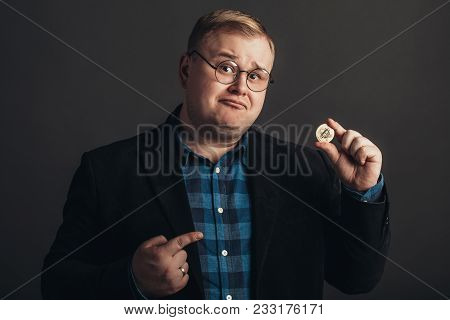 Fat Man Pointing At Golden Bitcoin In Hand, Digitall Symbol Of New Virtual Currency