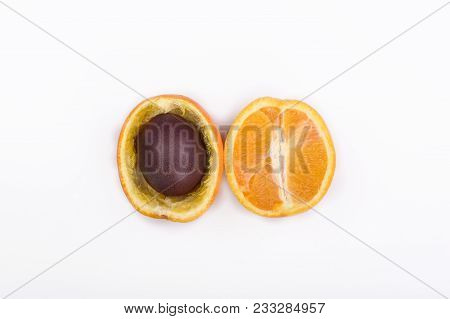 Easter Egg In One Of The Halves Of An Orange Close Up