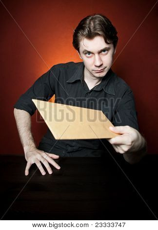 Young man with brown envelope