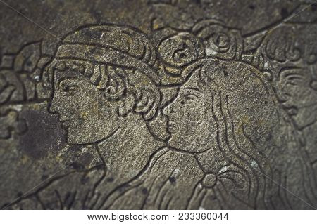 Bas-relief With A Portrait Of A Man And A Woman. Old Italian Bas-relief On A Household Theme With A 