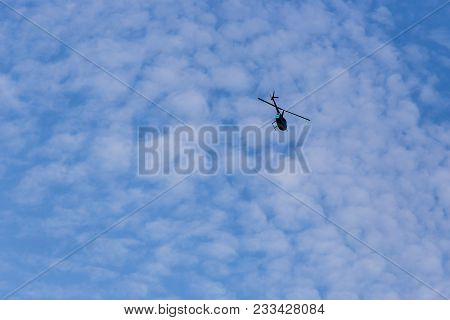 Helicopter Flying Against Blue Sky Against Blue Sky. Rio De Janeiro, Brazil