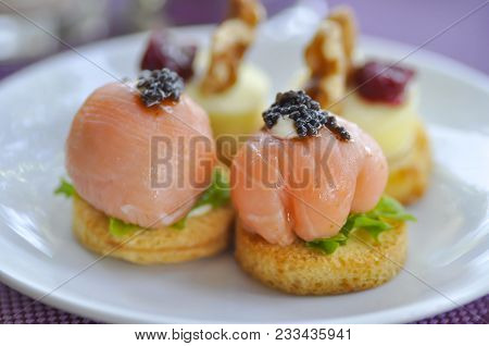 Salmon Canape Or Bread With Salmon And Carvier Topping