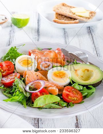 Smoked Salmon Salad With Greens, Tomatoes, Eggs And Avocado