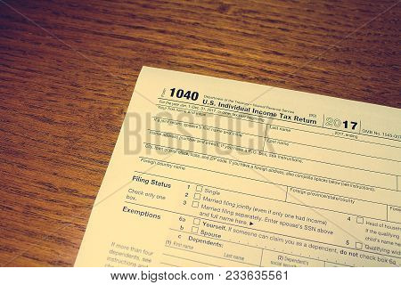 Tax Day. The Tax Form 1040 Is On A Wooden Table.