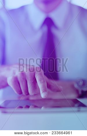 close-up of human hand  business man using tablet compuer at office