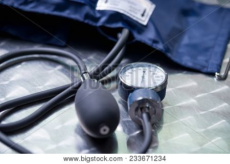 Close Up Of Tensiometer Over A Metallic Table, Medical Concept.