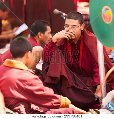 The Monk Wearing Spectacles, Among Colleagues Waiting For The Beginning Of A Ceremony Near Bouda Stu