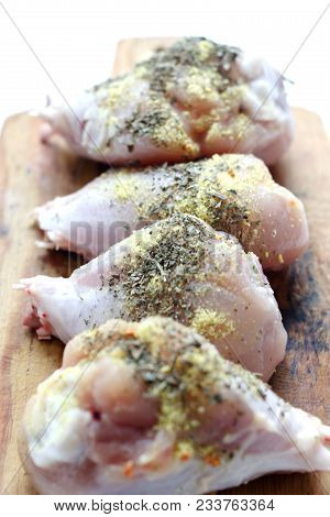 Chicken Drumsticks On A Wooden Board. On White, Isolated Background.top View. Flat Lay. Fresh Chicke