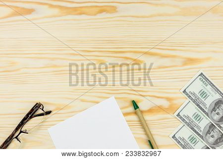 Sheet Of White Paper Mockup With  With Pen And Glasses On Wooden Background