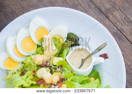 Fresh Vegetable Caesar Salad In White Bowl
