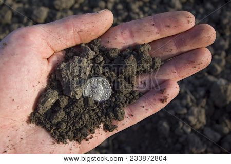 Hand Holding Roman Denarius (roman Silver Coin)
