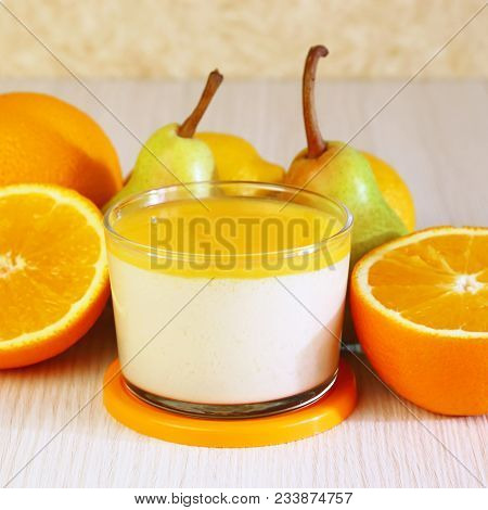 Food. Panna Cotta. Italian Milk Citrus Dessert Made Of Yogurt And Cream With Pear, Lemon And Orange.