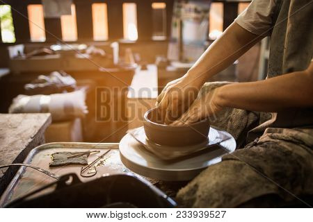 Potter's Hands Shaping Soft Clay To Make An Earthen Pot