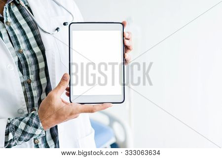 Close-up Of Man Doctor Therapeutic Advising With Positive Emotions  Holding Up And Showing Digital T