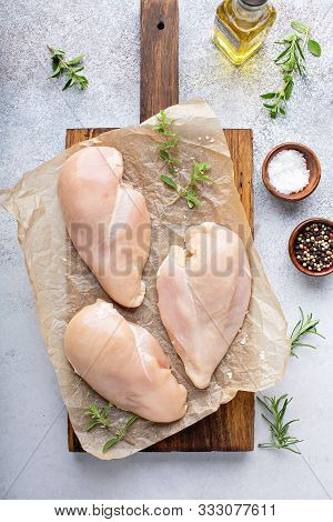 Raw Chicken Breast On A Cutting Board Ready To Be Cooked