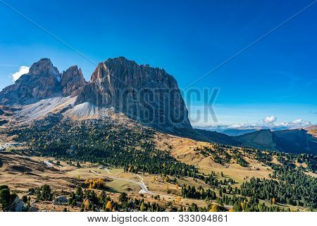 Panoramic View Of The Langkofel And Plattkofel Mountain From The South East On A Bright Autumn Day