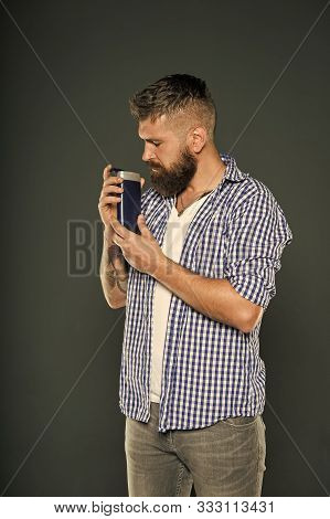 Man Hold Shampoo Bottle. Hair Care And Skincare. Handsome Bearded Guy Recommend Shower Gel Liquid So