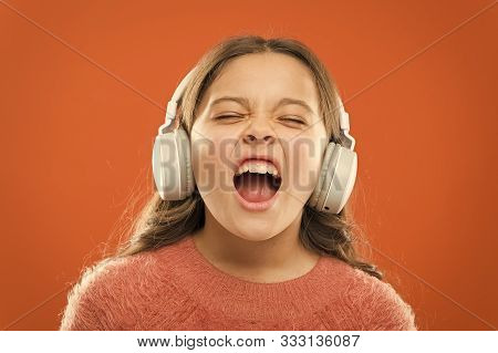For Better Vocal Performances. Adorable Small Child Doing Vocal On Song. Little Girl Listening To Mu