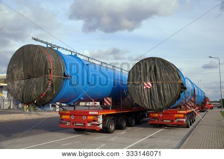 A Two Truck With A Special Semi-trailers For Transporting Oversized Loads. Oversize Load Or Exceptio