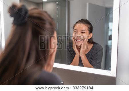 Face wash young Asian woman washing using facial scrub exfoliating skin cleansing of dead cells and oil for black pores clear skincare treatment.