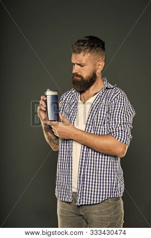 Barbershop Grooming. Man Hold Shampoo Bottle. Hair Care And Skincare. Handsome Bearded Guy Recommend