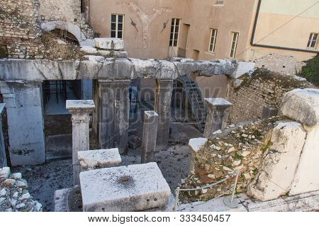 Italy, Brescia - December 24 2017: The View Of The Ancient Roman Temple Ruins Of Capitolium In Bresc